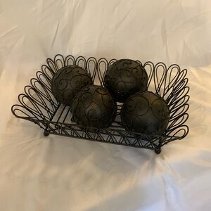 Black metal basket with four large metal decorative spheres